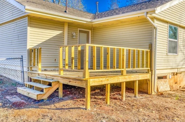 rear view of house with a wooden deck