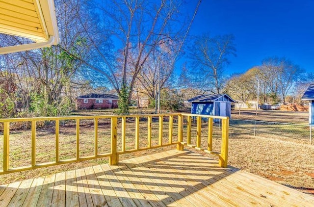 wooden deck featuring a shed