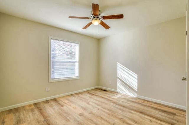 spare room featuring ceiling fan and light hardwood / wood-style floors