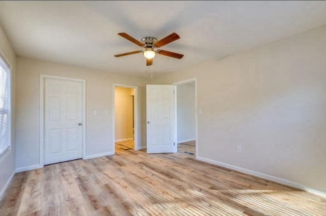 unfurnished bedroom with ceiling fan and light hardwood / wood-style flooring