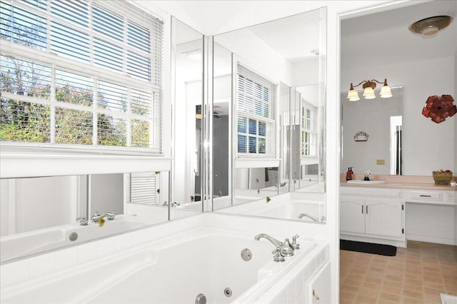 bathroom with vanity and tiled bath