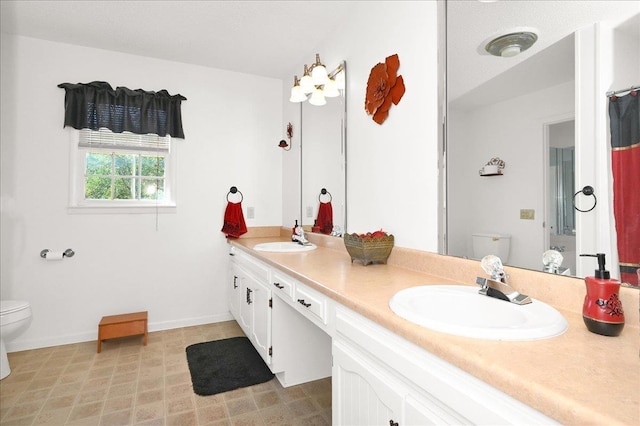 bathroom with vanity and toilet