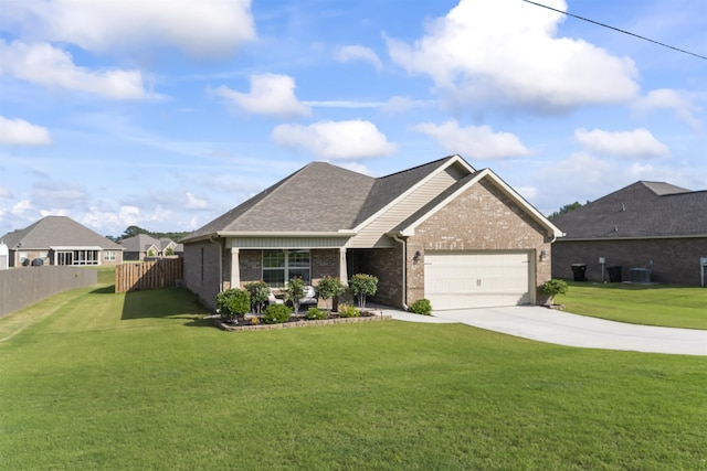 view of front of property featuring a garage and a front yard