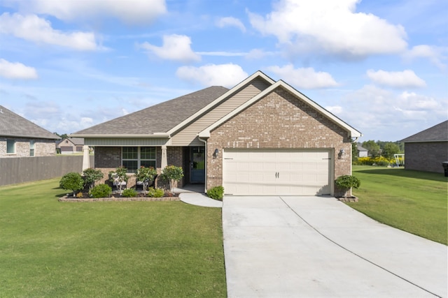 view of front of house featuring a garage and a front lawn