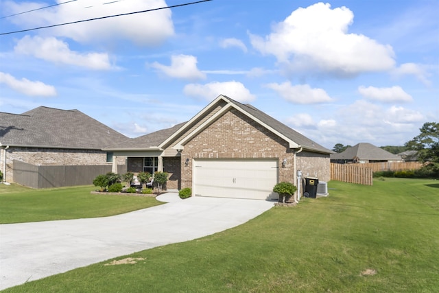 single story home featuring a garage and a front lawn