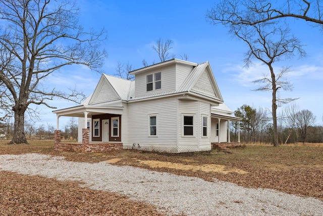 rear view of house with a porch