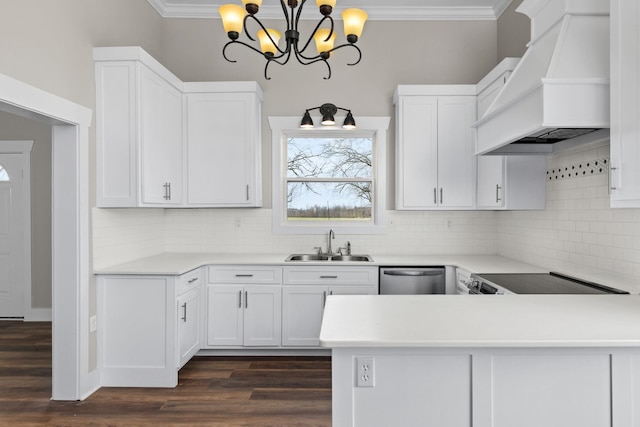 kitchen with sink, white cabinets, hanging light fixtures, stainless steel dishwasher, and custom range hood