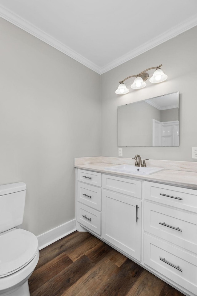 bathroom with vanity, wood-type flooring, and ornamental molding