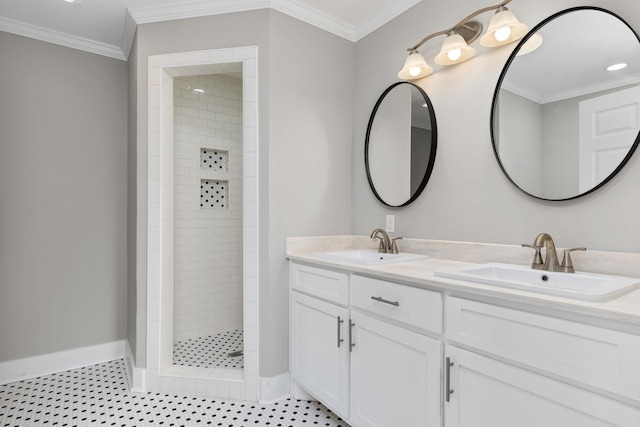 bathroom with tile patterned flooring, vanity, ornamental molding, and tiled shower