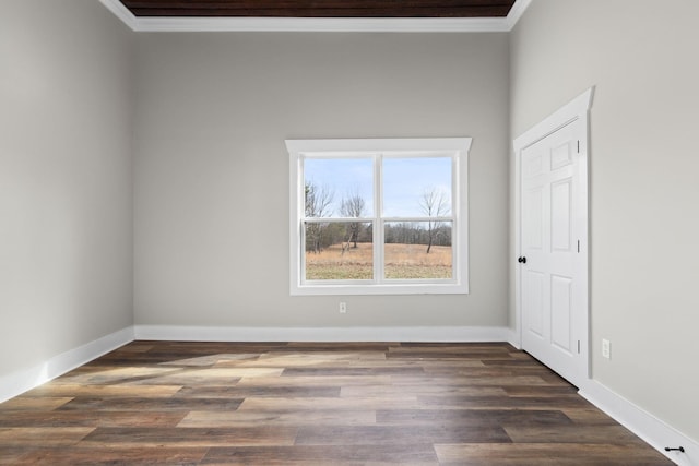 spare room featuring dark wood-type flooring