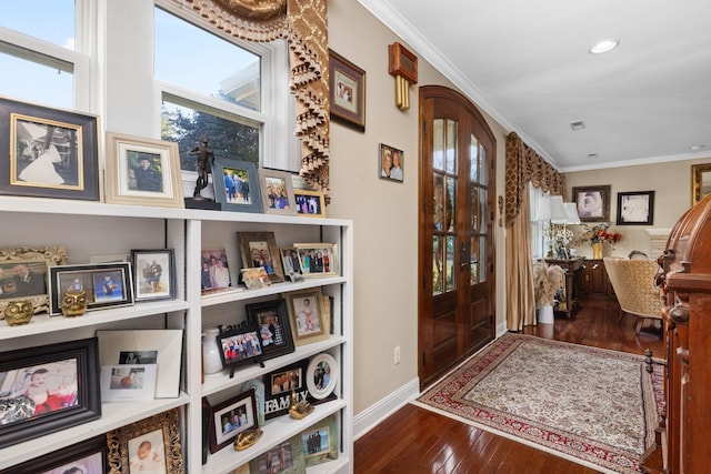 entryway featuring dark hardwood / wood-style flooring, crown molding, and french doors