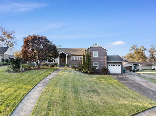 view of front of house featuring a front yard and a garage