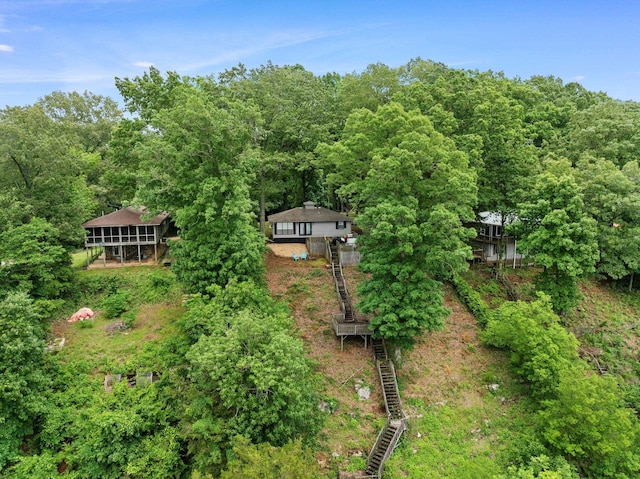 view of subject property featuring a forest