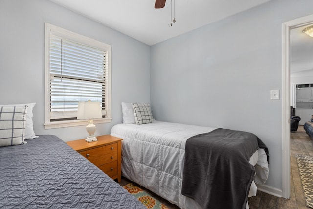 bedroom with wood finished floors and a ceiling fan