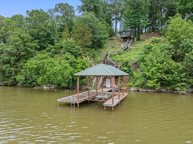 dock featuring stairs, a water view, and boat lift