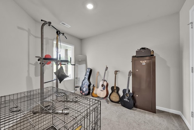  - workout area with carpet flooring and baseboards