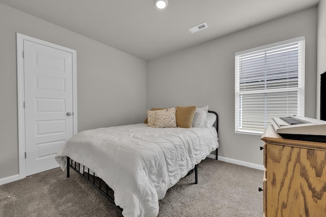  - bedroom featuring carpet flooring and baseboards