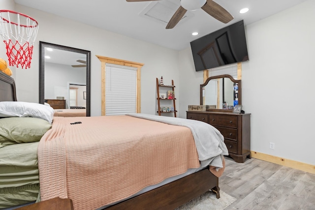 bedroom with ceiling fan and light wood-type flooring