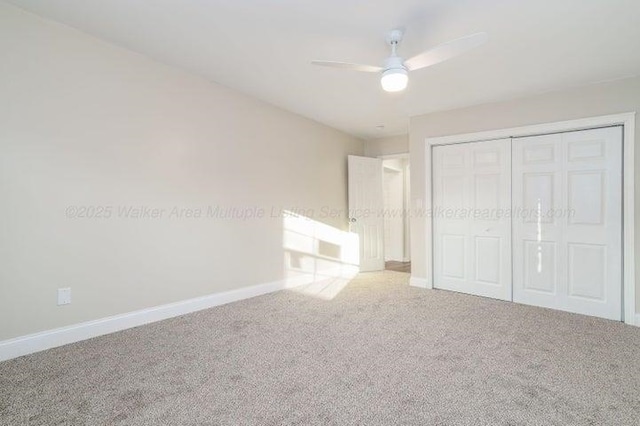  - unfurnished bedroom featuring carpet, baseboards, a closet, and ceiling fan