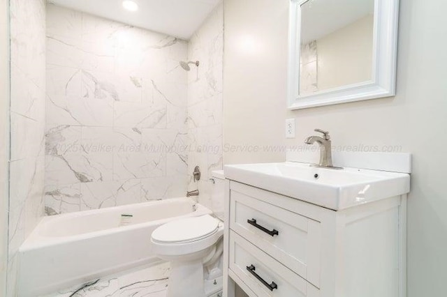  - bathroom with marble finish flooring, vanity, tub / shower combination, and toilet