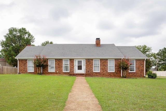 single story home with a front lawn