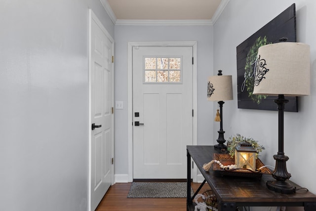 entryway with ornamental molding and wood finished floors