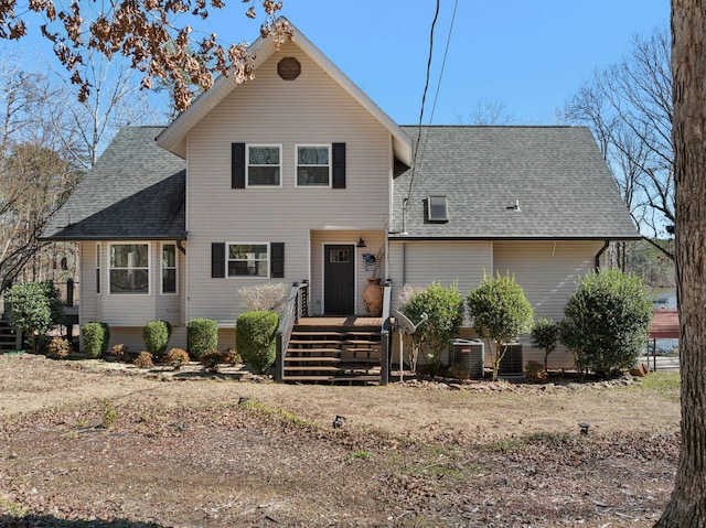 traditional home with a shingled roof