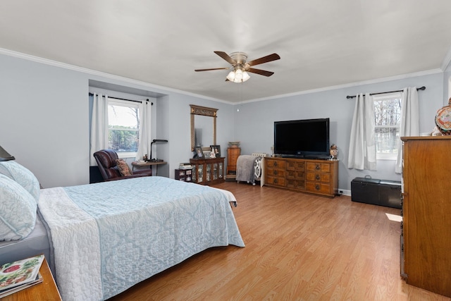 bedroom with a ceiling fan, light wood-type flooring, and crown molding