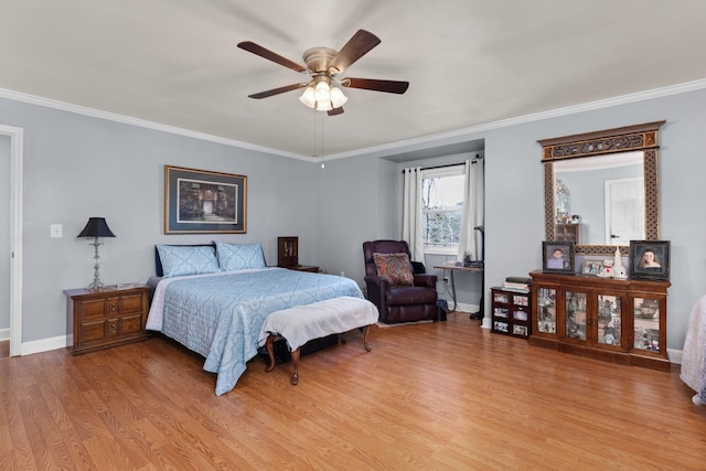 bedroom with ornamental molding, ceiling fan, light wood finished floors, and baseboards