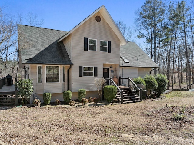 view of front of home featuring a shingled roof