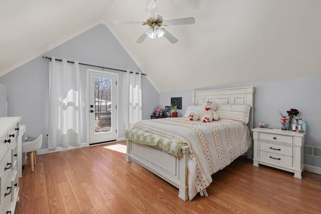 bedroom with vaulted ceiling, ceiling fan, light wood finished floors, and access to exterior