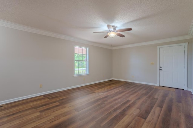 spare room featuring dark hardwood / wood-style floors, ceiling fan, ornamental molding, and a textured ceiling