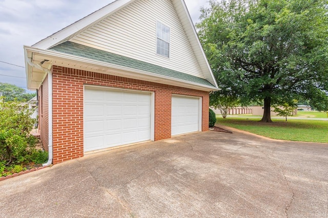 garage featuring a yard