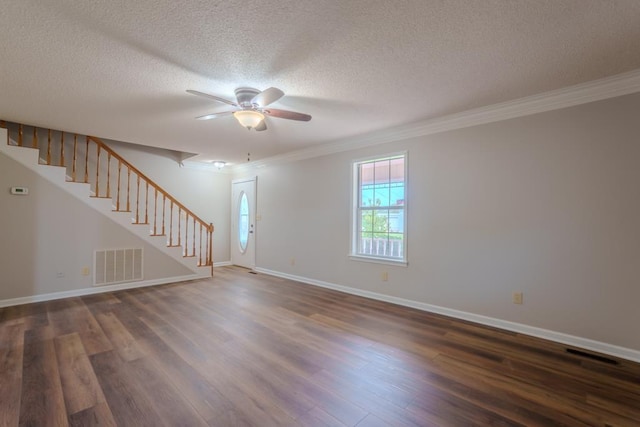 empty room with ceiling fan, dark hardwood / wood-style flooring, and ornamental molding