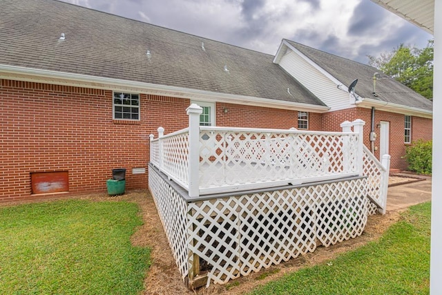 rear view of house featuring a yard