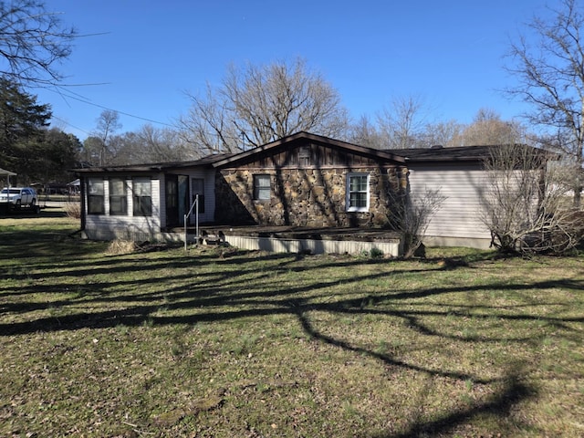 view of side of property with a yard