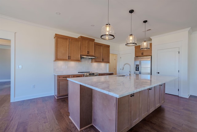 kitchen featuring dark wood-style flooring, crown molding, backsplash, appliances with stainless steel finishes, and under cabinet range hood