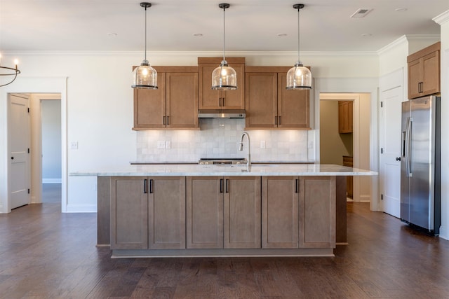 kitchen featuring stainless steel fridge, visible vents, dark wood-style flooring, crown molding, and under cabinet range hood