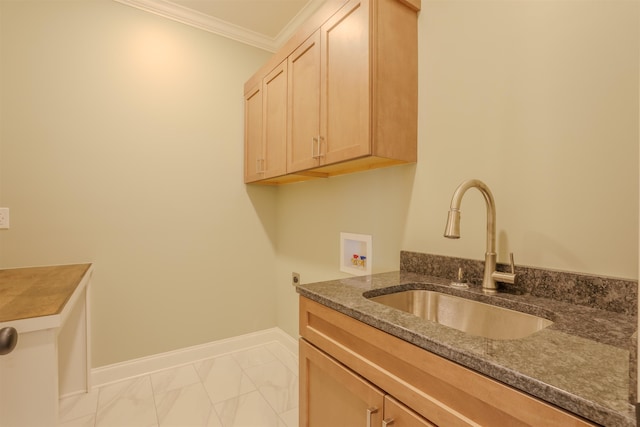 washroom featuring hookup for a washing machine, hookup for an electric dryer, a sink, ornamental molding, and cabinet space