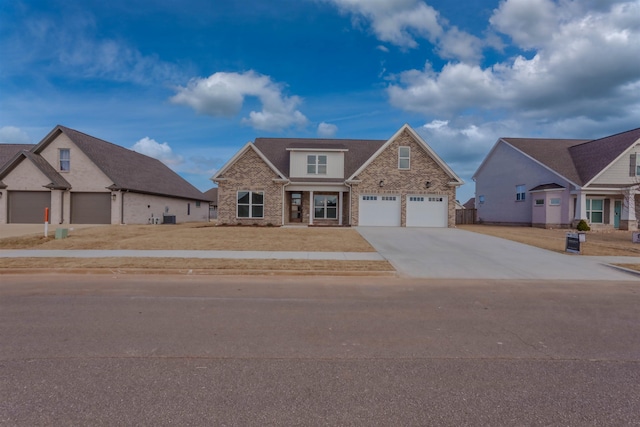 view of front facade featuring a garage, driveway, brick siding, and a front yard