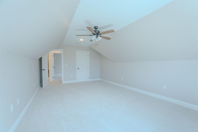 bonus room with a ceiling fan, vaulted ceiling, and baseboards