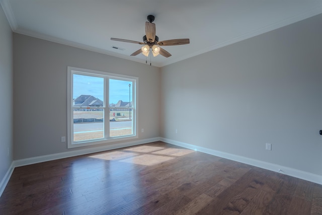 empty room with baseboards, wood finished floors, a ceiling fan, and crown molding