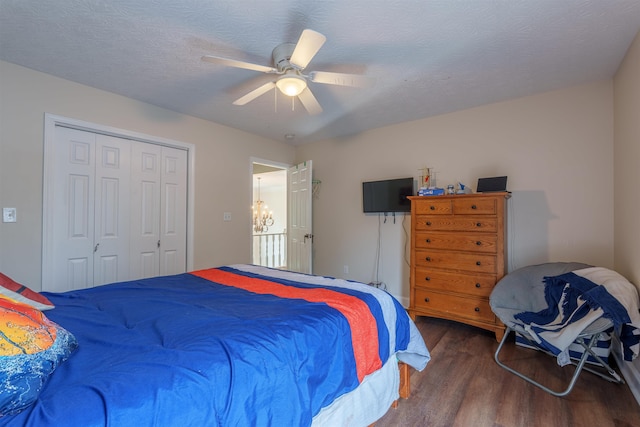  - bedroom featuring wood finished floors, a closet, and ceiling fan