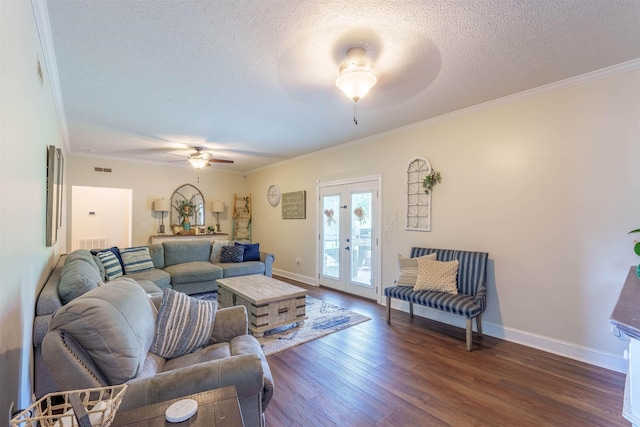  - living room featuring ceiling fan, a textured ceiling, ornamental molding, dark wood-style flooring, and french doors