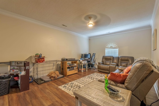  - living area featuring wood finished floors, crown molding, and a textured ceiling