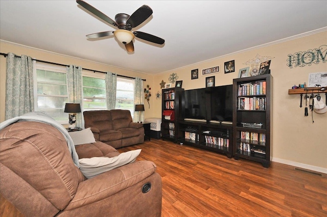 living room with ceiling fan, ornamental molding, and hardwood / wood-style flooring