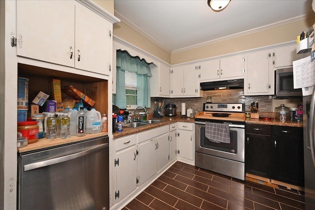 kitchen featuring sink, stainless steel appliances, backsplash, crown molding, and white cabinets