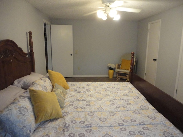 bedroom with ceiling fan and hardwood / wood-style flooring