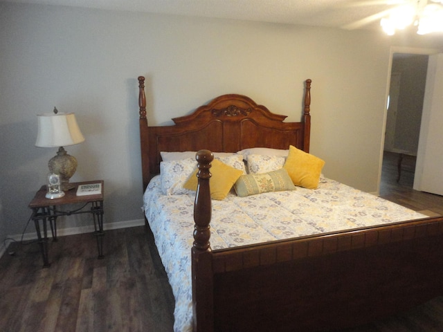 bedroom featuring dark hardwood / wood-style floors and ceiling fan