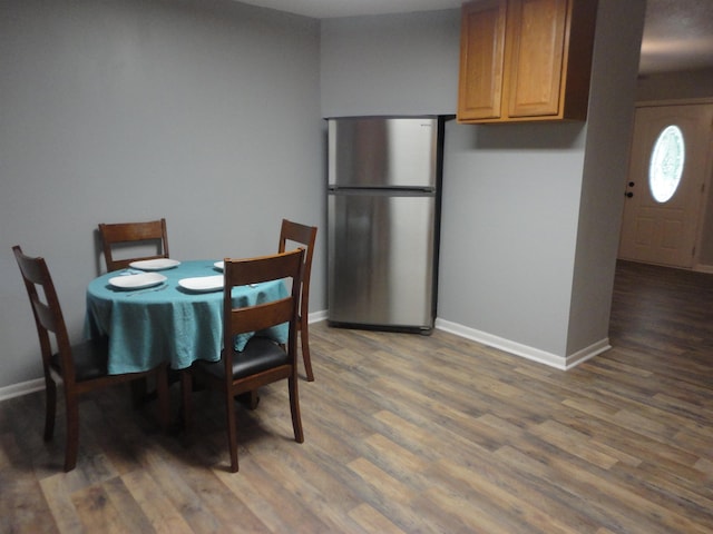 dining room with dark wood-type flooring